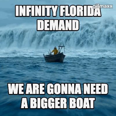 A large tidal wave incoming on a small fishing boat. Zoom in on fisherman on the boat saying "we are gonna need a bigger boat"