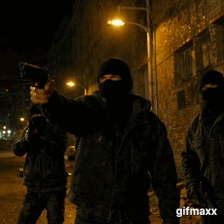 thugs, in balaclavas, firing guns in the air